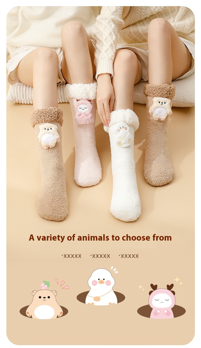 Plush heated socks with a pink deer badge