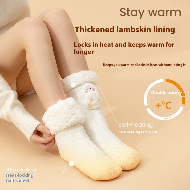 Plush heated socks with a pink deer badge