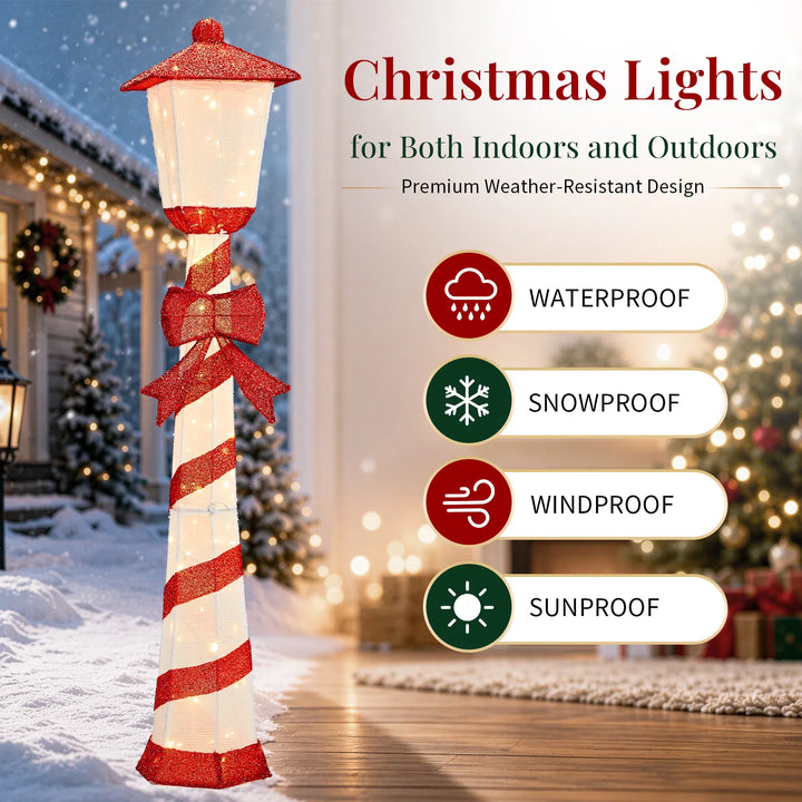 Lighted candy cane striped Christmas lamp post on a porch