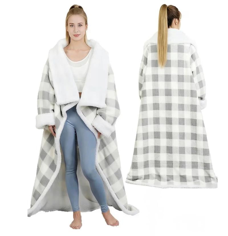 Person wearing sleeved electric heated blanket