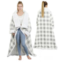 Person wearing sleeved electric heated blanket